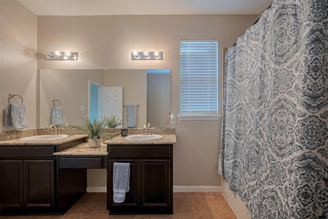 4323 N Vineyard Mdw Ln, Katy, TX 77449 - full bath with double vanity, tile patterned floors, curtained shower, and baseboards