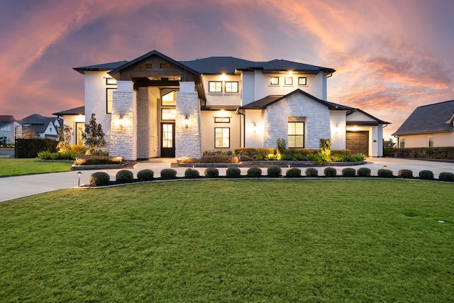 2105 Bennet Ct, Conroe, TX 77384 - view of front of house with stone siding, driveway, a lawn, and an attached garage