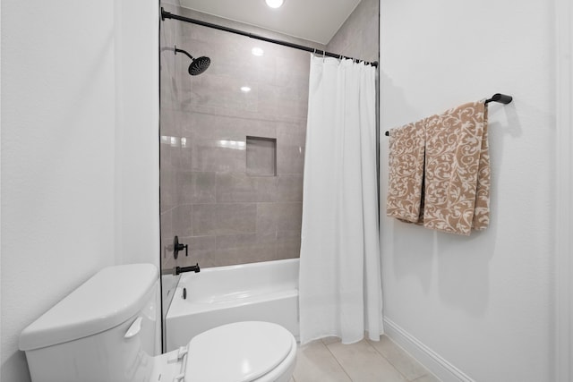 2105 Bennet Ct, Conroe, TX 77384 - bathroom with toilet, tile patterned floors, shower / bath combo, and baseboards