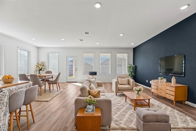 17011 Plover Rock Trl, Hockley, TX 77447 - living area featuring light wood-type flooring, recessed lighting, and baseboards