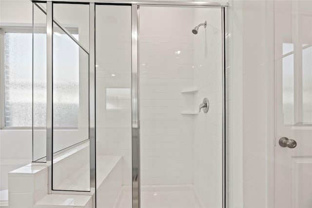 17011 Plover Rock Trl, Hockley, TX 77447 - bathroom featuring a stall shower and healthy amount of natural light