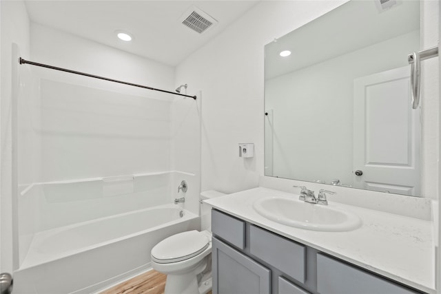 17011 Plover Rock Trl, Hockley, TX 77447 - full bathroom with toilet, vanity, bathing tub / shower combination, wood finished floors, and recessed lighting