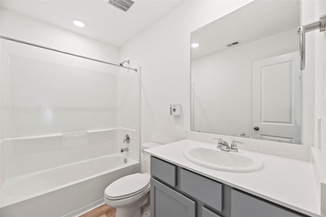 17011 Plover Rock Trl, Hockley, TX 77447 - bathroom with toilet, vanity, bathtub / shower combination, wood finished floors, and recessed lighting