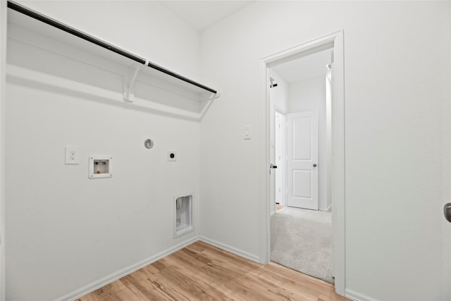 17011 Plover Rock Trl, Hockley, TX 77447 - washroom featuring hookup for an electric dryer, washer hookup, hookup for a gas dryer, light wood-style floors, and baseboards