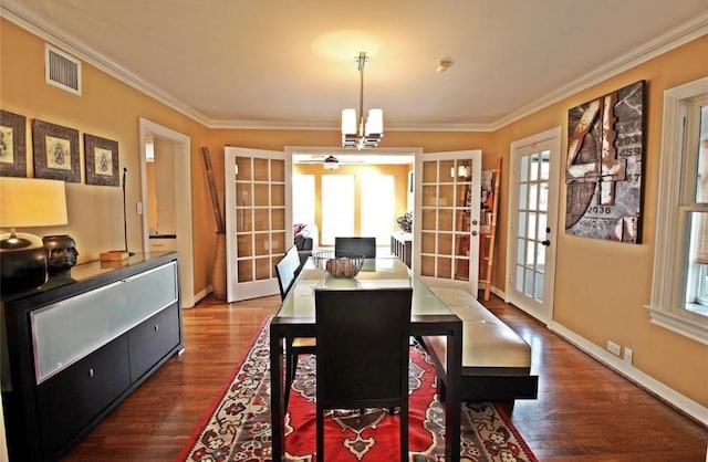 1216 S Shepherd Dr, Houston, TX 77019 - dining area featuring french doors, dark wood-style floors, ornamental molding, a chandelier, and baseboards