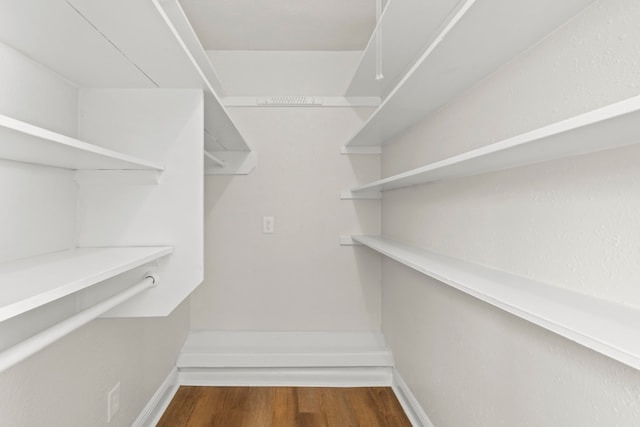 6034 Belmark St, Houston, TX 77033 - walk in closet with wood finished floors