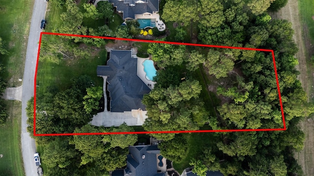 28611 Benders Crossing Dr, Spring, TX 77386 - aerial view of property and surrounding area with a pool area and property boundaries highlighted