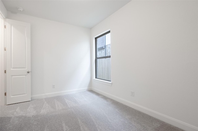 829 Laguna Green Ln, Katy, TX 77493 - spare room with baseboards, carpet floors, and a smoke detector