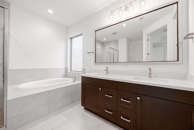 829 Laguna Green Ln, Katy, TX 77493 - full bath featuring a garden tub, double vanity, a stall shower, tile patterned flooring, and recessed lighting