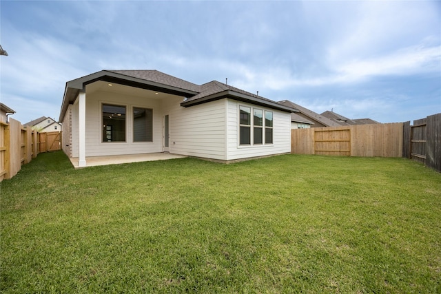 829 Laguna Green Ln, Katy, TX 77493 - rear view of property with a patio area and roof with shingles