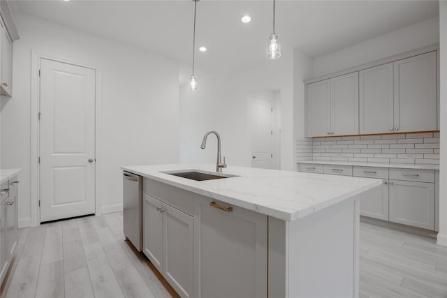 829 Laguna Green Ln, Katy, TX 77493 - kitchen featuring a sink, stainless steel dishwasher, recessed lighting, light wood finished floors, and decorative backsplash