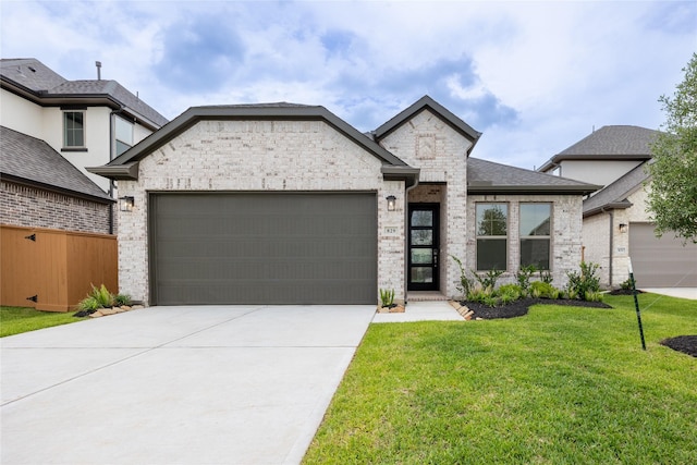 829 Laguna Green Ln, Katy, TX 77493 - view of front of house with a garage, a front lawn, concrete driveway, and stone siding