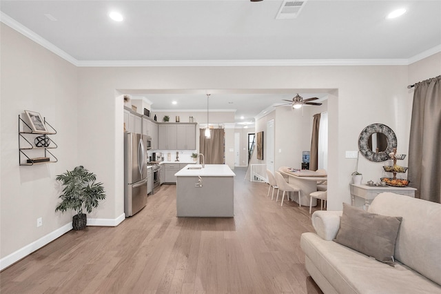 5014 Lillian St, Houston, TX 77007 - kitchen featuring open floor plan, appliances with stainless steel finishes, ceiling fan, light countertops, and ornamental molding
