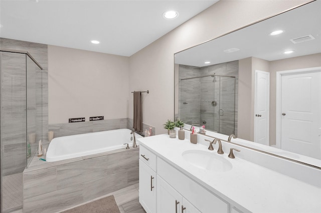 5014 Lillian St, Houston, TX 77007 - full bath with a bath, vanity, a shower stall, and recessed lighting