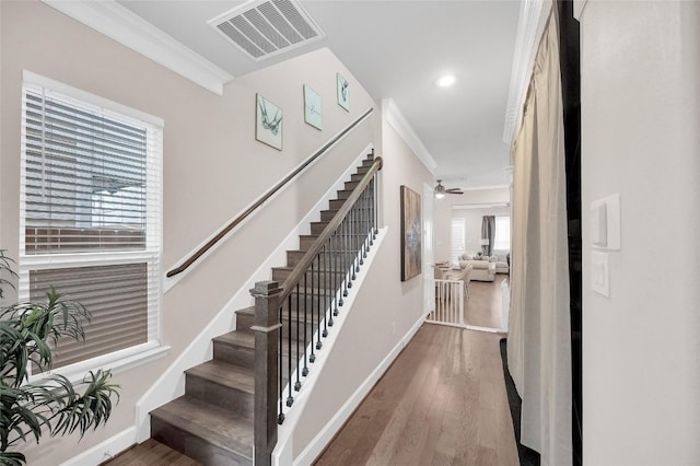 5014 Lillian St, Houston, TX 77007 - stairs with crown molding, wood finished floors, baseboards, recessed lighting, and ceiling fan