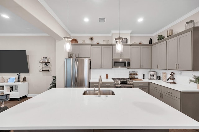 5014 Lillian St, Houston, TX 77007 - kitchen featuring stainless steel appliances, gray cabinets, a sink, a kitchen island with sink, and light countertops