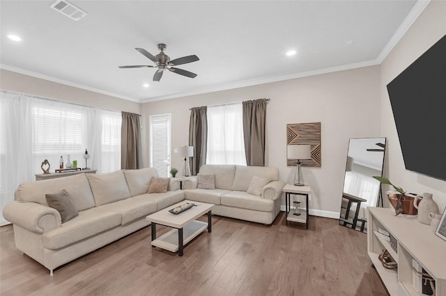 5014 Lillian St, Houston, TX 77007 - living area with plenty of natural light, a ceiling fan, wood finished floors, ornamental molding, and recessed lighting