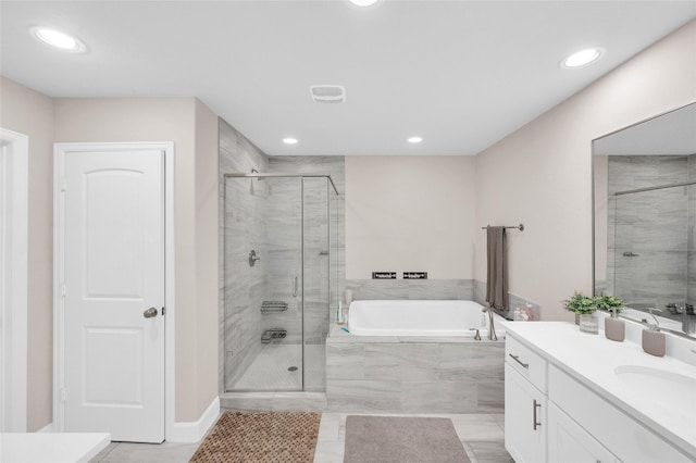 5014 Lillian St, Houston, TX 77007 - full bathroom featuring vanity, a garden tub, a stall shower, and recessed lighting