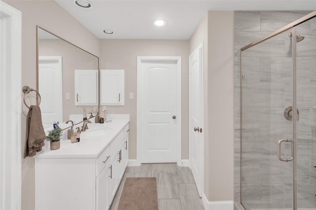 5014 Lillian St, Houston, TX 77007 - full bathroom with double vanity, a stall shower, and baseboards