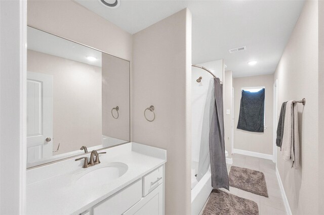5014 Lillian St, Houston, TX 77007 - bathroom with vanity, tile patterned floors, shower / tub combo, and baseboards