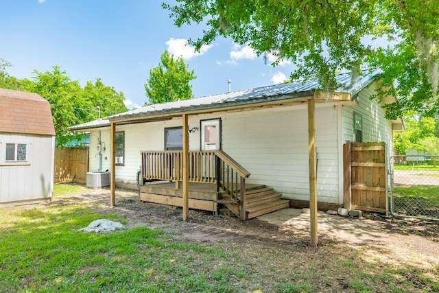 105 Wisteria St, Lake Jackson, TX 77566 - back of house with central air condition unit and metal roof