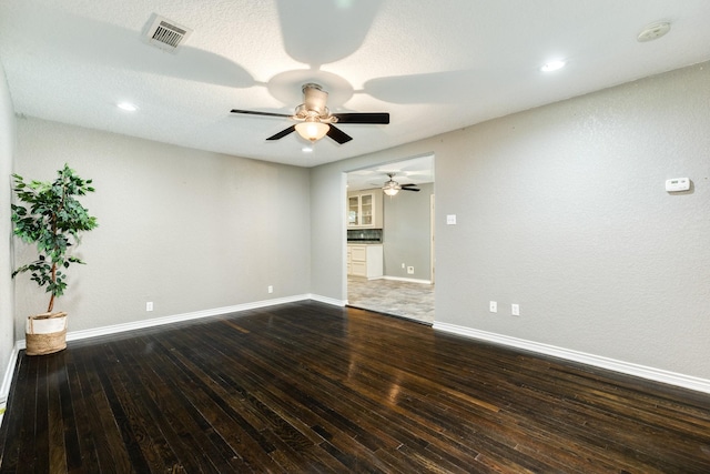 105 Wisteria St, Lake Jackson, TX 77566 - empty room featuring a ceiling fan, dark wood finished floors, baseboards, recessed lighting, and a smoke detector