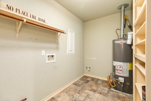 105 Wisteria St, Lake Jackson, TX 77566 - laundry area with water heater, stone finish flooring, hookup for a washing machine, and baseboards