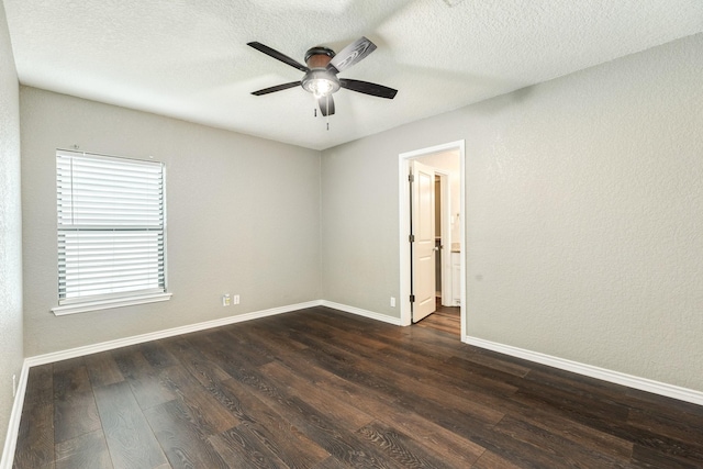 105 Wisteria St, Lake Jackson, TX 77566 - spare room featuring ceiling fan, dark wood-style floors, baseboards, and a textured ceiling