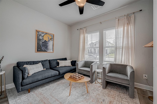 21450 Petherton Dr, Tomball, TX 77375 - living room featuring ceiling fan, wood finished floors, and baseboards