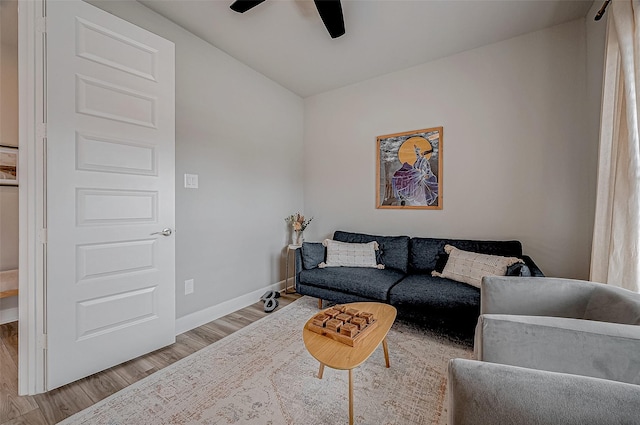 21450 Petherton Dr, Tomball, TX 77375 - living room featuring wood finished floors, a ceiling fan, and baseboards