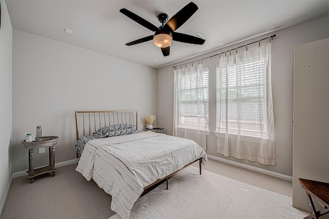 21450 Petherton Dr, Tomball, TX 77375 - carpeted bedroom featuring baseboards and ceiling fan
