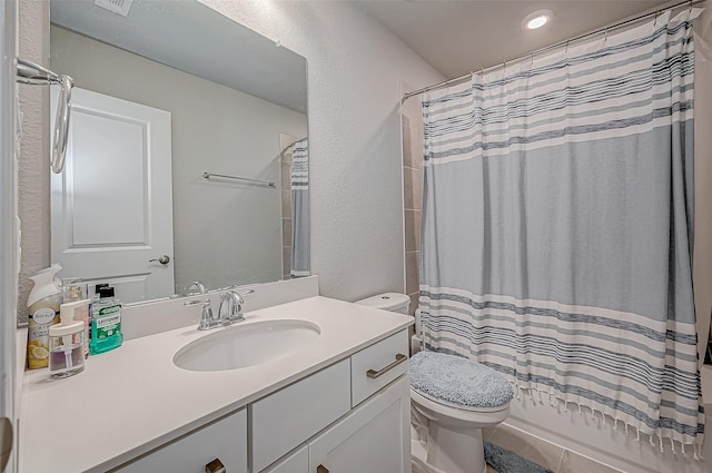 21450 Petherton Dr, Tomball, TX 77375 - bathroom featuring toilet, vanity, and a textured wall