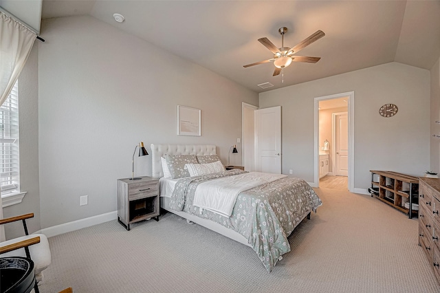 21450 Petherton Dr, Tomball, TX 77375 - bedroom featuring light carpet, vaulted ceiling, baseboards, ceiling fan, and ensuite bathroom