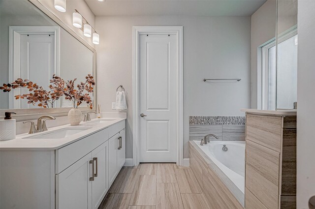 21450 Petherton Dr, Tomball, TX 77375 - full bathroom with double vanity and a bath