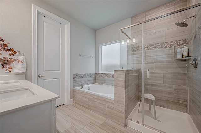 21450 Petherton Dr, Tomball, TX 77375 - full bathroom featuring a shower stall, a bath, double vanity, and tile patterned floors