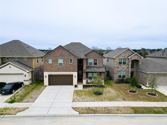 21450 Petherton Dr, Tomball, TX 77375 - view of front facade featuring concrete driveway, brick siding, a front lawn, and a garage
