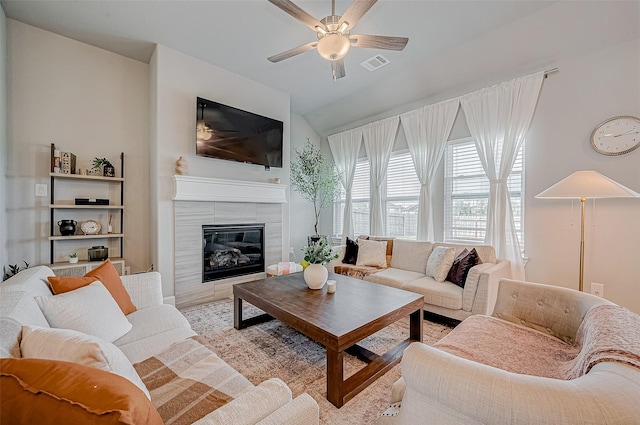 21450 Petherton Dr, Tomball, TX 77375 - living room featuring a ceiling fan, a fireplace, and vaulted ceiling