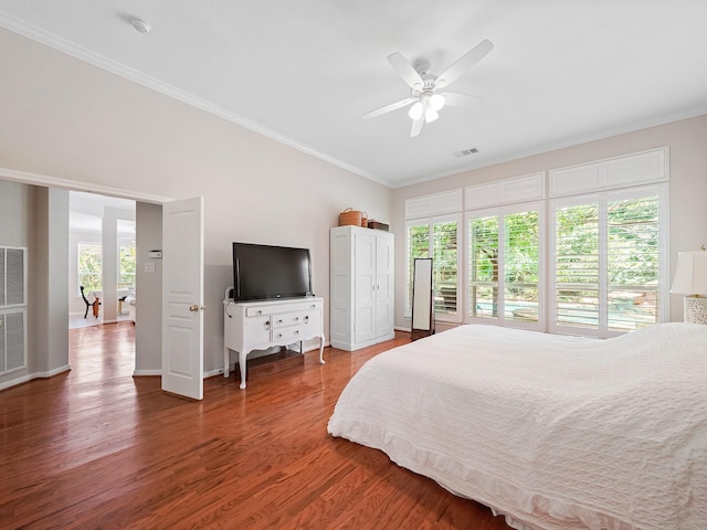 23647 Litchfield Bend Ln, Katy, TX 77494 - bedroom featuring wood finished floors, ornamental molding, baseboards, and a ceiling fan