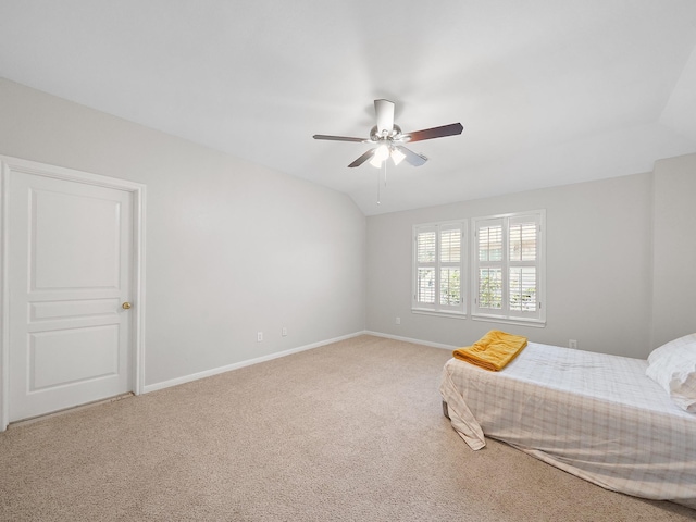 23647 Litchfield Bend Ln, Katy, TX 77494 - bedroom with carpet flooring, baseboards, a ceiling fan, and lofted ceiling