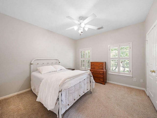 23647 Litchfield Bend Ln, Katy, TX 77494 - bedroom with light carpet, baseboards, and a ceiling fan