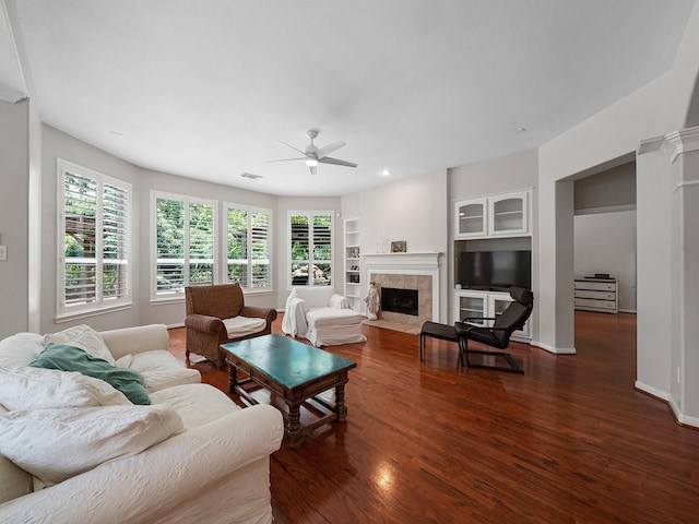 23647 Litchfield Bend Ln, Katy, TX 77494 - living room with dark wood-style flooring, a ceiling fan, plenty of natural light, a tile fireplace, and recessed lighting