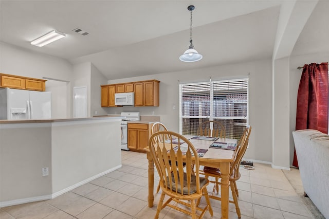 11823 Lois Ln, Pinehurst, TX 77362 - dining room featuring light tile patterned floors, lofted ceiling, and baseboards