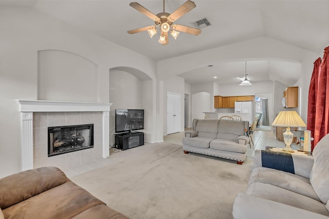 11823 Lois Ln, Pinehurst, TX 77362 - living area with lofted ceiling, ceiling fan, a fireplace, and arched walkways
