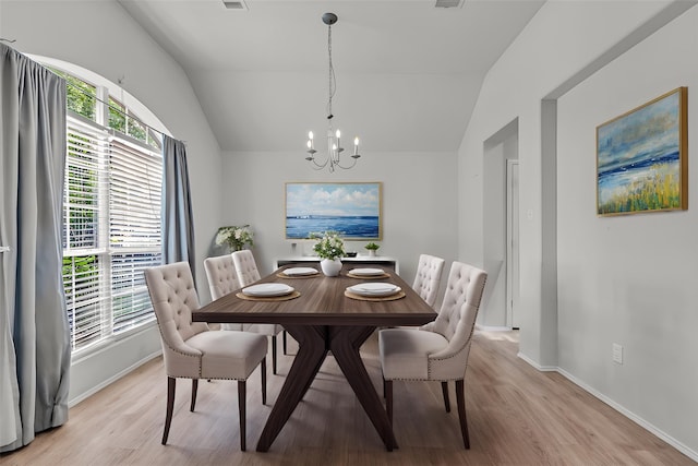 11823 Lois Ln, Pinehurst, TX 77362 - dining area featuring a chandelier, vaulted ceiling, light wood-type flooring, and baseboards