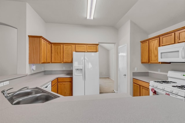 11823 Lois Ln, Pinehurst, TX 77362 - kitchen featuring white appliances, a sink, light countertops, and brown cabinets