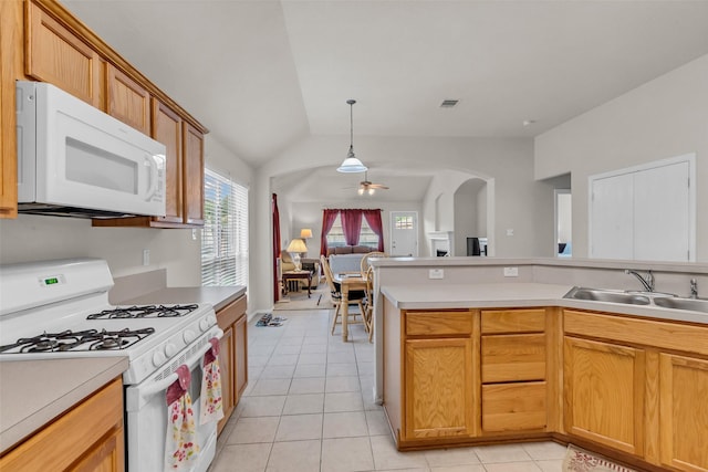 11823 Lois Ln, Pinehurst, TX 77362 - kitchen with white appliances, open floor plan, a sink, ceiling fan, and light tile patterned flooring