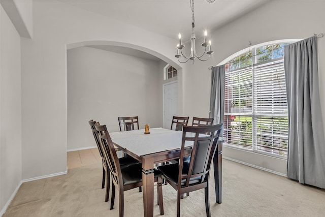 11823 Lois Ln, Pinehurst, TX 77362 - dining space with light colored carpet, plenty of natural light, arched walkways, and a chandelier
