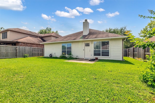 11823 Lois Ln, Pinehurst, TX 77362 - rear view of house featuring a chimney and a patio