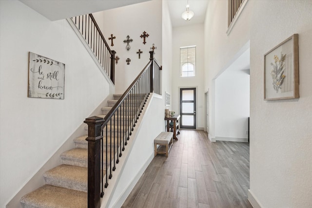 1685 Daylight Lake Dr, Katy, TX 77493 - entrance foyer featuring wood finished floors, stairs, a towering ceiling, and baseboards