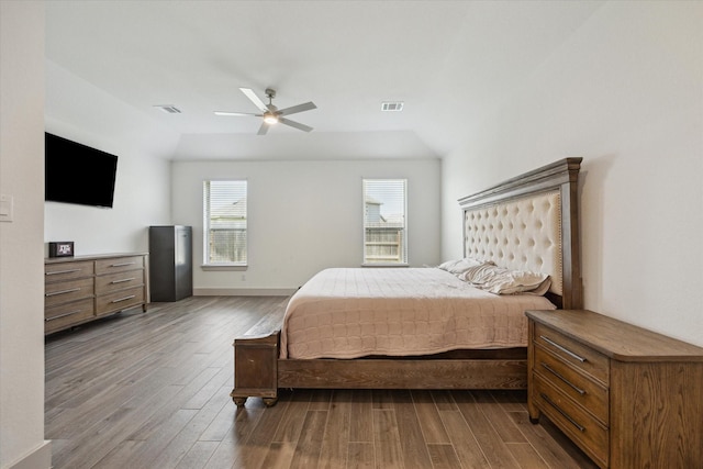 1685 Daylight Lake Dr, Katy, TX 77493 - bedroom featuring dark wood-style flooring, a ceiling fan, and baseboards